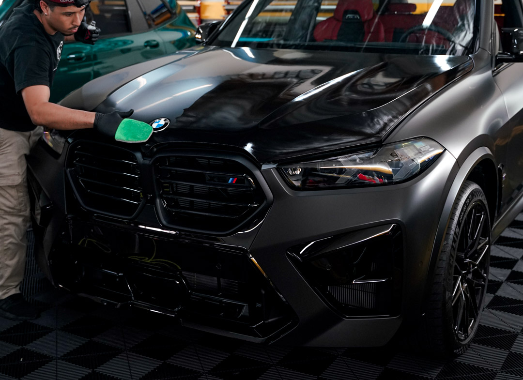 BMW X6M getting Ceramic Coat to help protect wrap. 